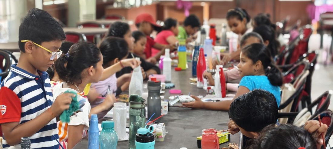 Trading scroll time for skill time. Kids turning old water bottles into something they mad